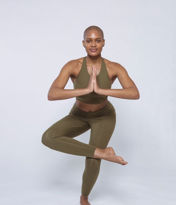 Confident man in a focused pose, demonstrating body control and balance.